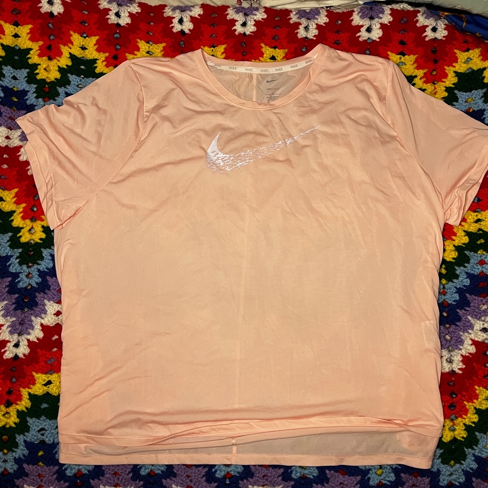 salmon colored nike shirt